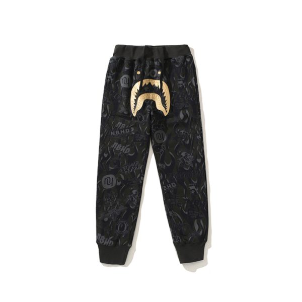 BAPE x NBHD joint style shark head black and gold trousers BAPE x NBHD joint style shark head black and gold trousers