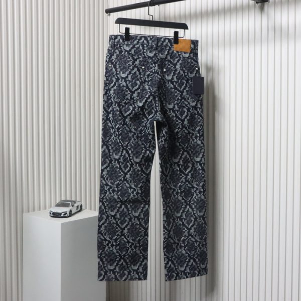 Louis Vuitton asymmetric snake print jeans