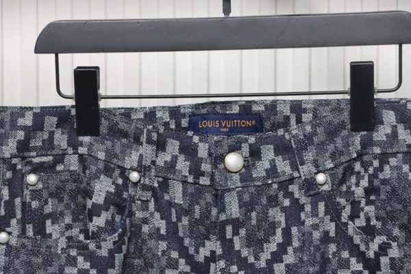 Louis Vuitton asymmetric snake print jeans