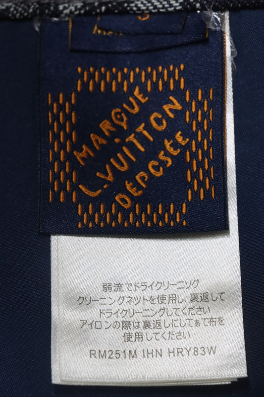 Louis Vuitton asymmetric snake print jeans