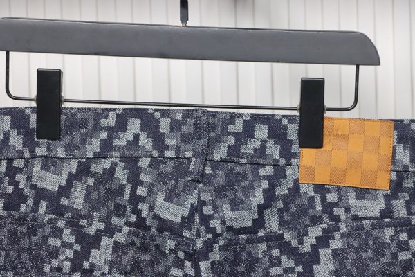 Louis Vuitton asymmetric snake print jeans