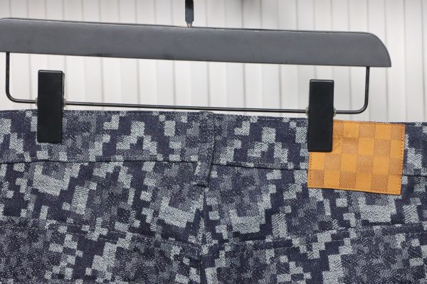 Louis Vuitton asymmetric snake print jeans