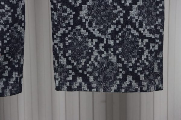 Louis Vuitton asymmetric snake print jeans